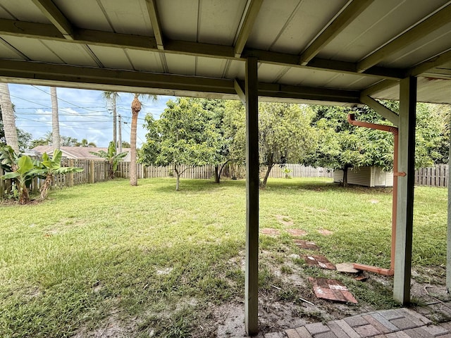1114 SW Del Rio Blvd, Port Saint Lucie, FL 34953 - fenced backyard featuring a storage unit