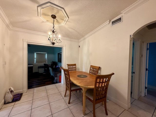 1114 SW Del Rio Blvd, Port Saint Lucie, FL 34953 - dining area with arched walkways, light tile patterned floors, ornamental molding, and a textured ceiling