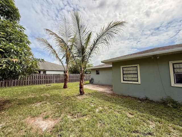 1114 SW Del Rio Blvd, Port Saint Lucie, FL 34953 - view of yard featuring a patio