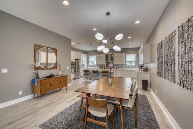 5178 Beckman Ter, Palm Beach Gardens, FL 33418 - dining area featuring light wood-style floors, recessed lighting, and a chandelier
