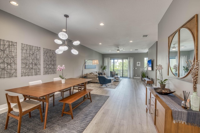 5178 Beckman Ter, Palm Beach Gardens, FL 33418 - dining room featuring light wood-style flooring, a ceiling fan, recessed lighting, and a chandelier