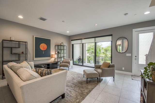 5178 Beckman Ter, Palm Beach Gardens, FL 33418 - living room with light tile patterned floors and recessed lighting