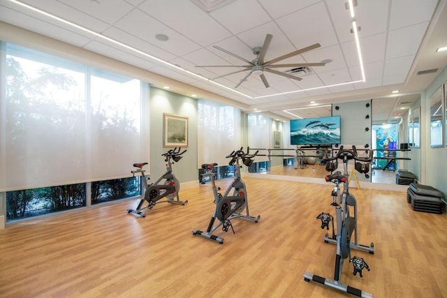 5178 Beckman Ter, Palm Beach Gardens, FL 33418 - workout area with a paneled ceiling, wood finished floors, and ceiling fan