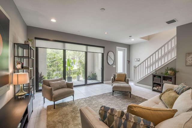 5178 Beckman Ter, Palm Beach Gardens, FL 33418 - living room featuring tile patterned floors, stairway, and recessed lighting