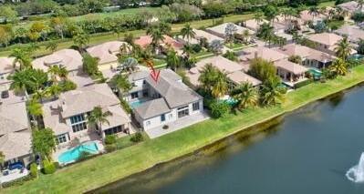 6630 Grande Orchid Way, Delray Beach, FL 33446 - aerial perspective of suburban area featuring a pool area and a large body of water
