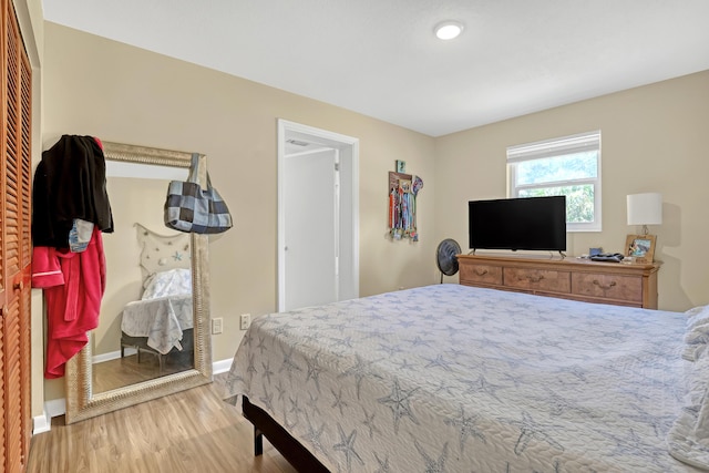 1395 SE Darling St, Stuart, FL 34997 - bedroom featuring wood finished floors and baseboards