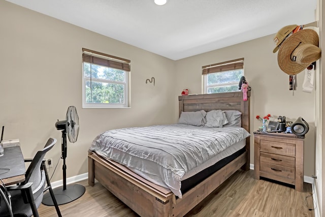 1395 SE Darling St, Stuart, FL 34997 - bedroom with light wood-type flooring and baseboards