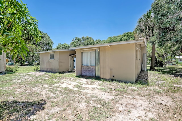 1395 SE Darling St, Stuart, FL 34997 - back of property featuring stucco siding