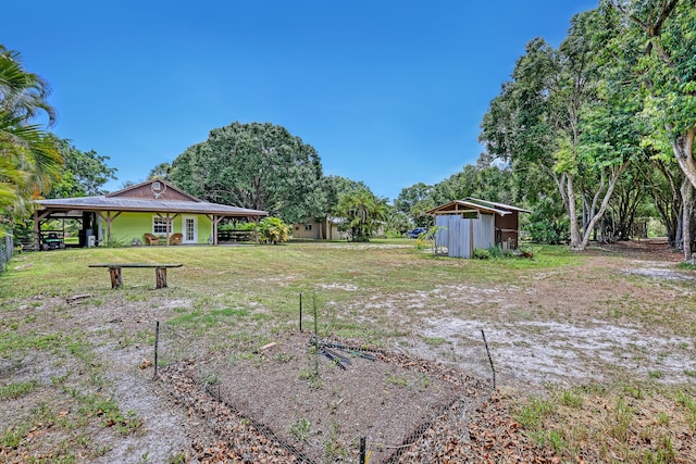 1395 SE Darling St, Stuart, FL 34997 - view of grassy yard with a shed