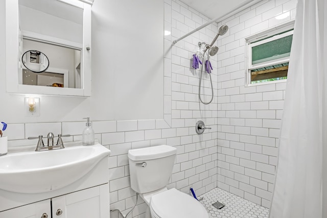 1395 SE Darling St, Stuart, FL 34997 - bathroom with vanity, a tile shower, and tile walls
