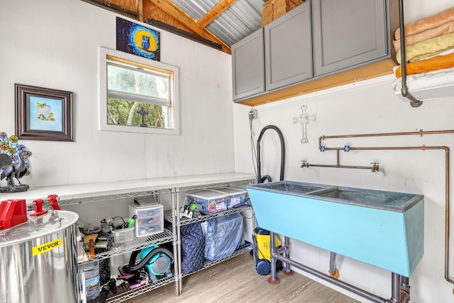 1395 SE Darling St, Stuart, FL 34997 - laundry room with wood finished floors