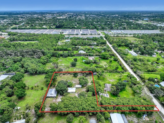 1395 SE Darling St, Stuart, FL 34997 - aerial view of property's location featuring property parcel outlined and a tree filled landscape