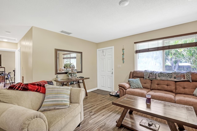 1395 SE Darling St, Stuart, FL 34997 - living area featuring wood finished floors and baseboards