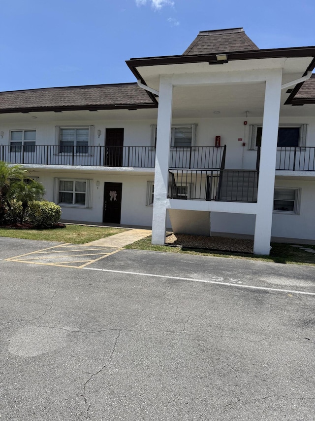 3111 Gardens E Dr Unit 31, Palm Beach Gardens, FL 33410 - view of building exterior featuring uncovered parking