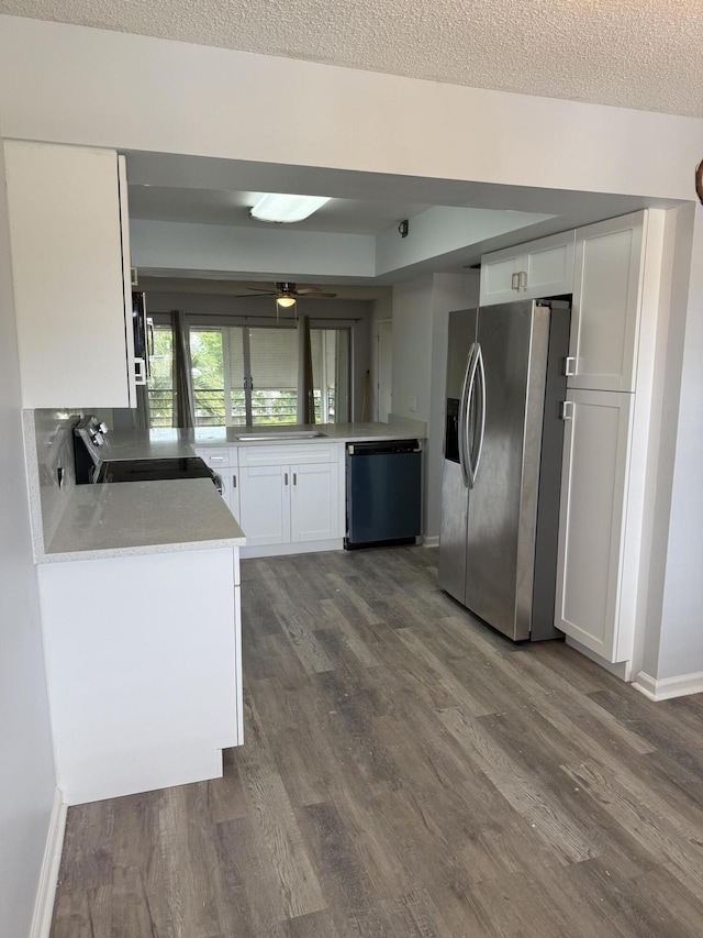 3111 Gardens E Dr Unit 31, Palm Beach Gardens, FL 33410 - kitchen featuring stainless steel fridge, dishwashing machine, dark wood-style floors, white cabinets, and a textured ceiling