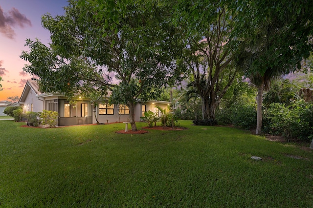 7980 Cloverfield Cir, Boca Raton, FL 33433 - yard at dusk featuring a yard
