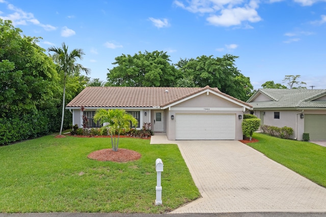 7980 Cloverfield Cir, Boca Raton, FL 33433 - single story home with a garage, a tiled roof, driveway, stucco siding, and a front yard