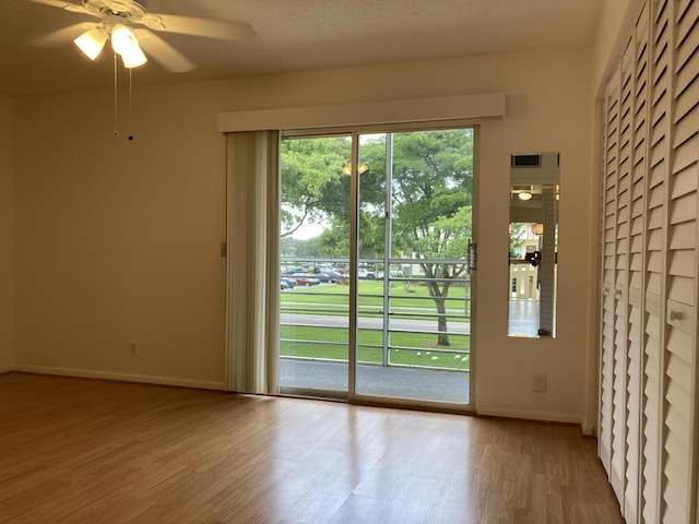 353 Mansfield I Unit 353I, Boca Raton, FL 33434 - doorway featuring wood finished floors and a ceiling fan