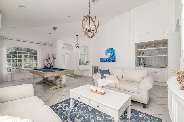 1513 SE Holyrood Ln, Port Saint Lucie, FL 34952 - living area featuring light tile patterned floors, a chandelier, pool table, and high vaulted ceiling