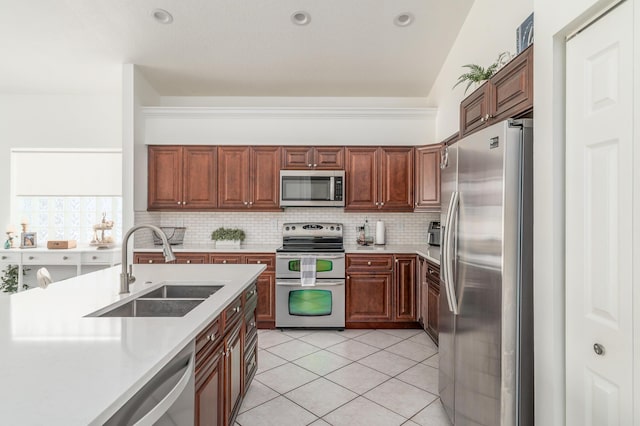 1513 SE Holyrood Ln, Port Saint Lucie, FL 34952 - kitchen featuring stainless steel appliances, light countertops, backsplash, and light tile patterned floors