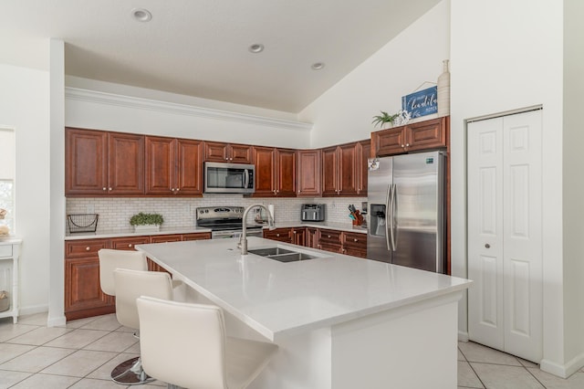 1513 SE Holyrood Ln, Port Saint Lucie, FL 34952 - kitchen with stainless steel appliances, light tile patterned floors, backsplash, light countertops, and recessed lighting