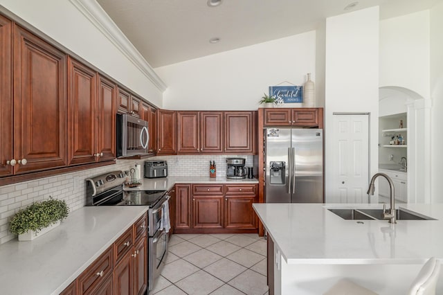 1513 SE Holyrood Ln, Port Saint Lucie, FL 34952 - kitchen with appliances with stainless steel finishes, tasteful backsplash, light tile patterned flooring, and lofted ceiling
