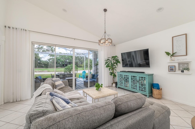1513 SE Holyrood Ln, Port Saint Lucie, FL 34952 - living room featuring light tile patterned floors, a chandelier, and high vaulted ceiling