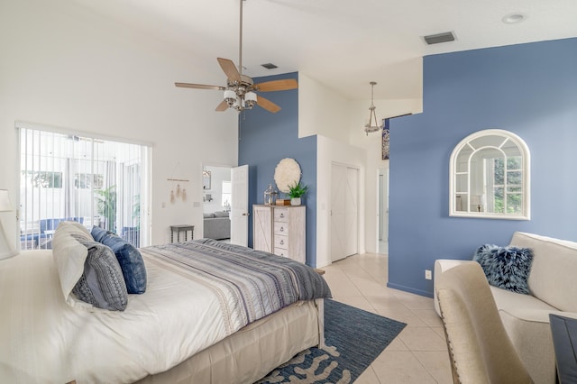1513 SE Holyrood Ln, Port Saint Lucie, FL 34952 - bedroom featuring high vaulted ceiling, access to exterior, light tile patterned floors, multiple windows, and ceiling fan