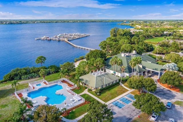 1513 SE Holyrood Ln, Port Saint Lucie, FL 34952 - bird's eye view of a pool and a nearby body of water