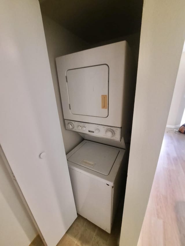 4855 Via Palm Lks Unit 904, West Palm Beach, FL 33417 - washroom featuring estacked washer and dryer