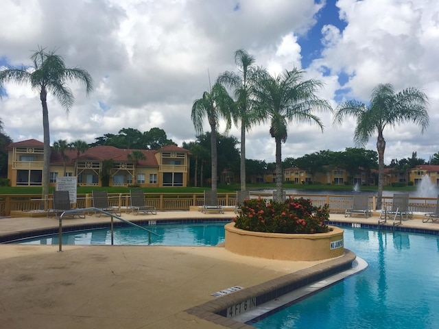 4855 Via Palm Lks Unit 904, West Palm Beach, FL 33417 - community pool featuring a patio