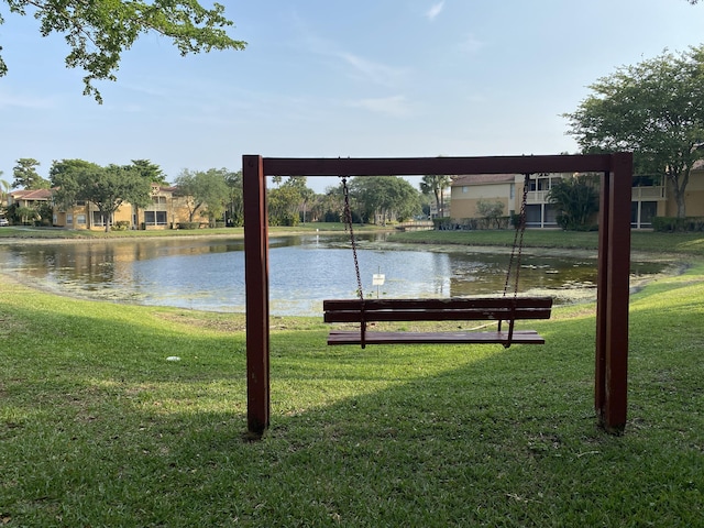 4855 Via Palm Lks Unit 904, West Palm Beach, FL 33417 - view of property's community with a water view and a lawn