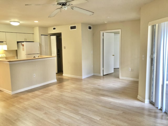 4855 Via Palm Lks Unit 904, West Palm Beach, FL 33417 - kitchen with freestanding refrigerator, a ceiling fan, white cabinetry, light wood-style floors, and recessed lighting