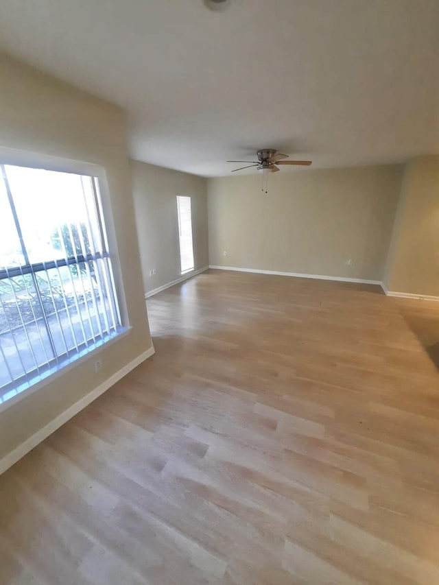 4855 Via Palm Lks Unit 904, West Palm Beach, FL 33417 - empty room featuring light wood-style flooring and ceiling fan
