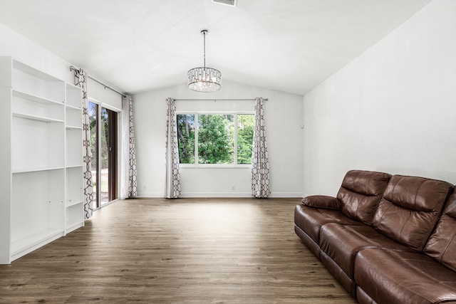 5711 NW 125th Ave, Coral Springs, FL 33076 - living area featuring healthy amount of natural light, a chandelier, wood finished floors, and lofted ceiling