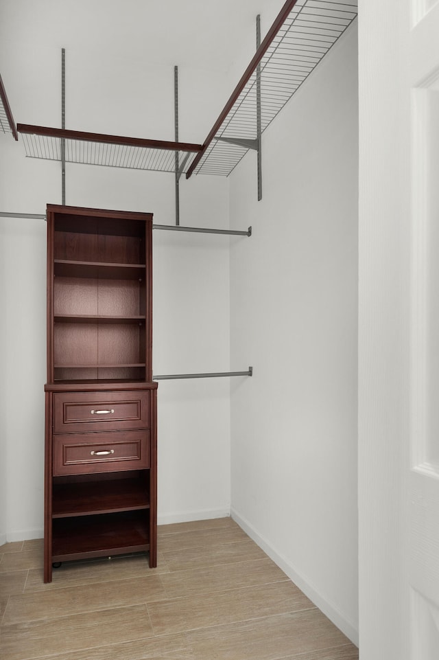 5711 NW 125th Ave, Coral Springs, FL 33076 - walk in closet featuring light wood finished floors