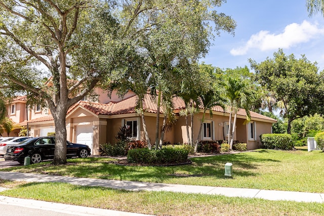 5711 NW 125th Ave, Coral Springs, FL 33076 - view of front of property with an attached garage, stucco siding, a tile roof, and a front lawn