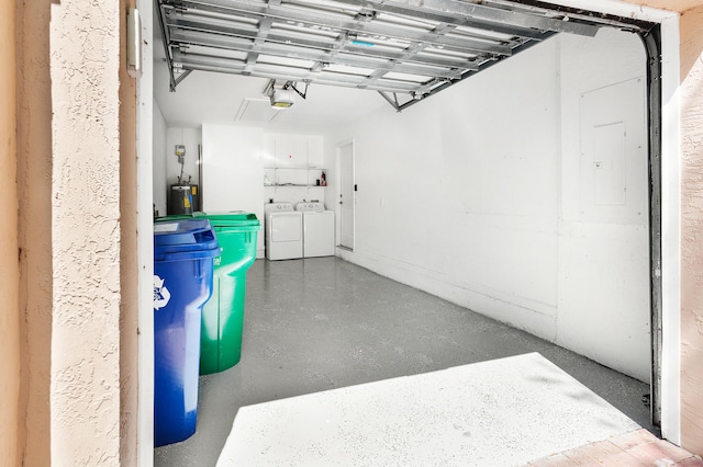 5711 NW 125th Ave, Coral Springs, FL 33076 - garage featuring washing machine and dryer, a garage door opener, and electric water heater