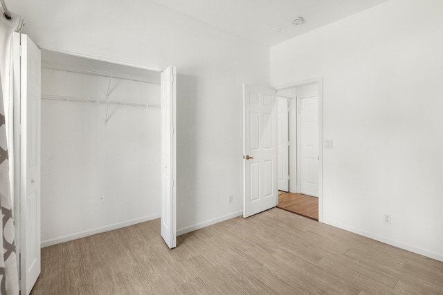 5711 NW 125th Ave, Coral Springs, FL 33076 - unfurnished bedroom with light wood-type flooring and a closet