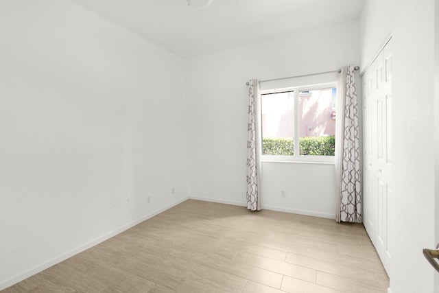 5711 NW 125th Ave, Coral Springs, FL 33076 - empty room featuring light wood-type flooring and baseboards