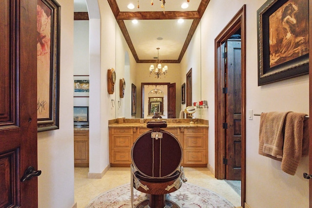 3870 NE 31st Ave, Lighthouse Point, FL 33064 - bathroom featuring crown molding, vanity, a chandelier, and tile patterned flooring