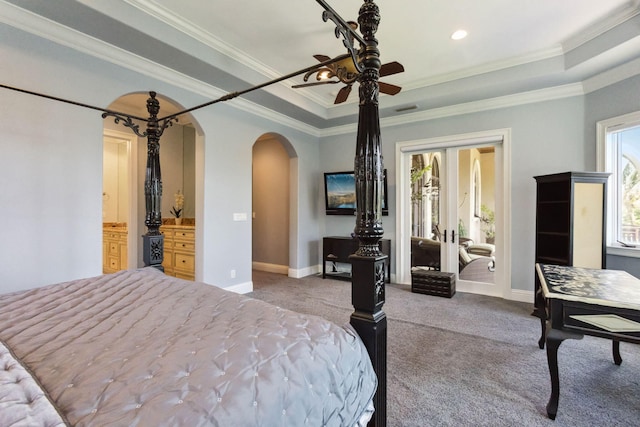 3870 NE 31st Ave, Lighthouse Point, FL 33064 - bedroom featuring arched walkways, carpet floors, a tray ceiling, crown molding, and french doors