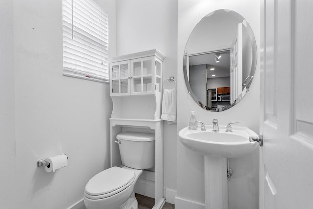 2536 SW 14th Ave Unit 1102, Fort Lauderdale, FL 33315 - bathroom featuring toilet and baseboards