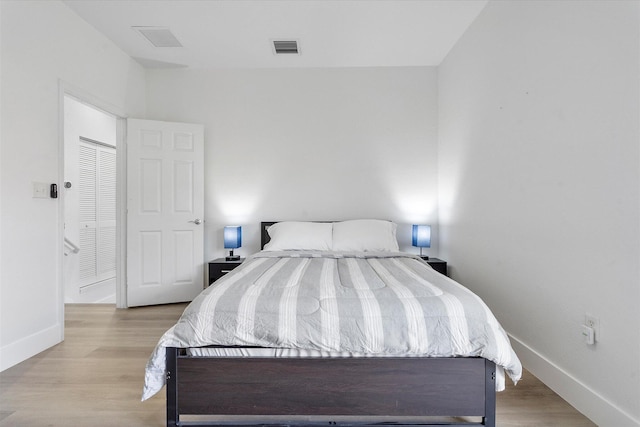 2536 SW 14th Ave Unit 1102, Fort Lauderdale, FL 33315 - bedroom featuring baseboards and wood finished floors