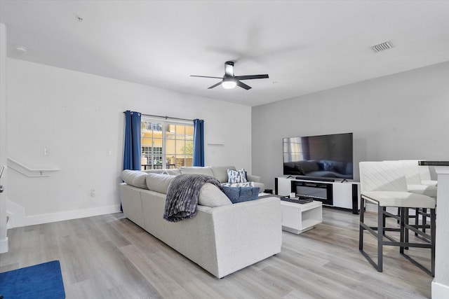2536 SW 14th Ave Unit 1102, Fort Lauderdale, FL 33315 - living room with a ceiling fan and light wood finished floors