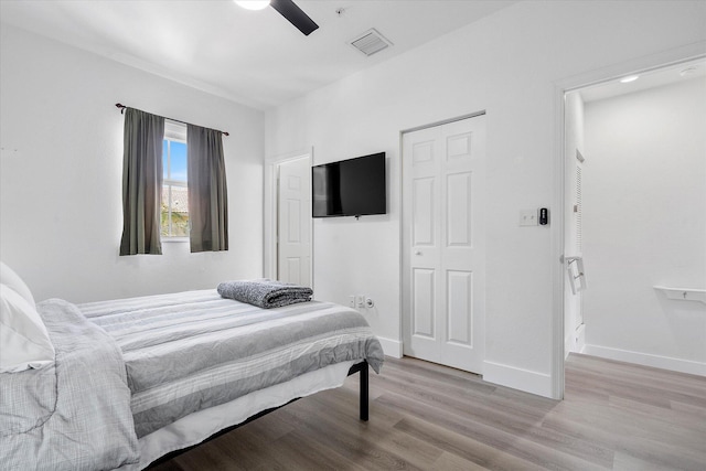 2536 SW 14th Ave Unit 1102, Fort Lauderdale, FL 33315 - bedroom with wood finished floors and ceiling fan