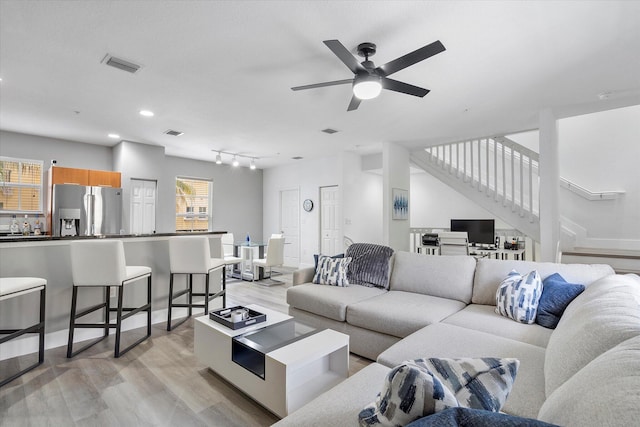 2536 SW 14th Ave Unit 1102, Fort Lauderdale, FL 33315 - living area with light wood-type flooring, a ceiling fan, stairs, and rail lighting