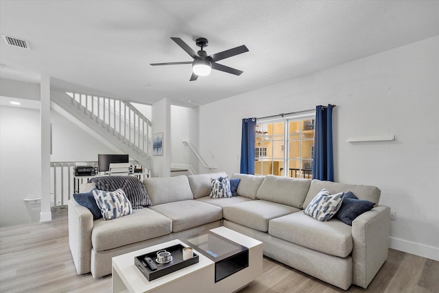2536 SW 14th Ave Unit 1102, Fort Lauderdale, FL 33315 - living room with light wood-style flooring, ceiling fan, and stairway