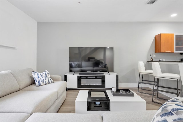 2536 SW 14th Ave Unit 1102, Fort Lauderdale, FL 33315 - living room featuring light wood finished floors and recessed lighting