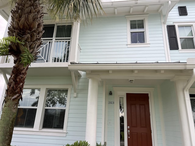 3303 E Mallory Blvd, Jupiter, FL 33458 - doorway to property featuring a balcony